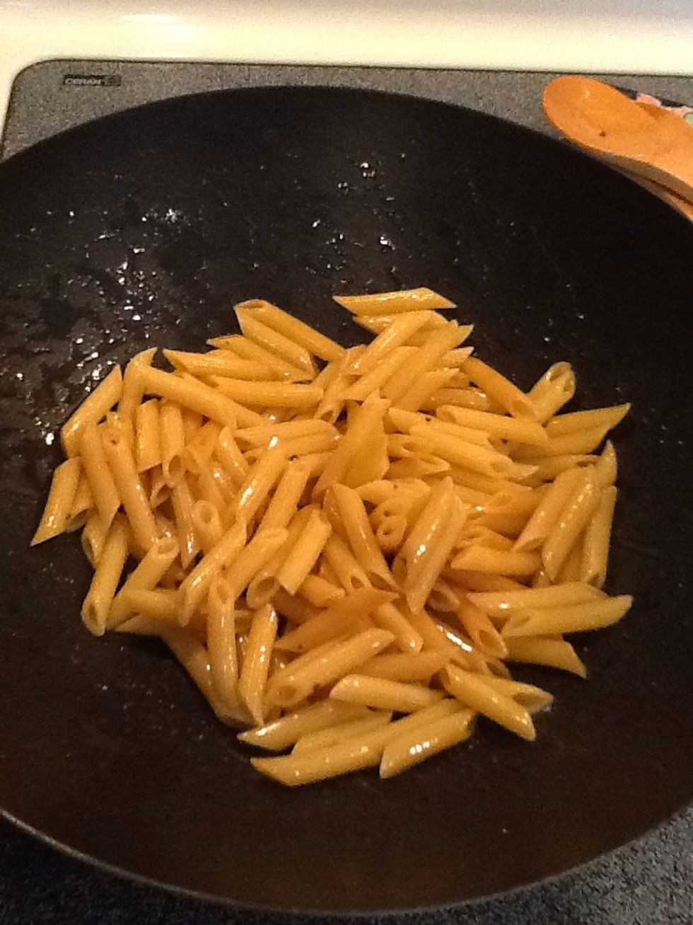 Toss penne into the oil and butter and stir to mix. Cook a few minutes until pasta is heated through.