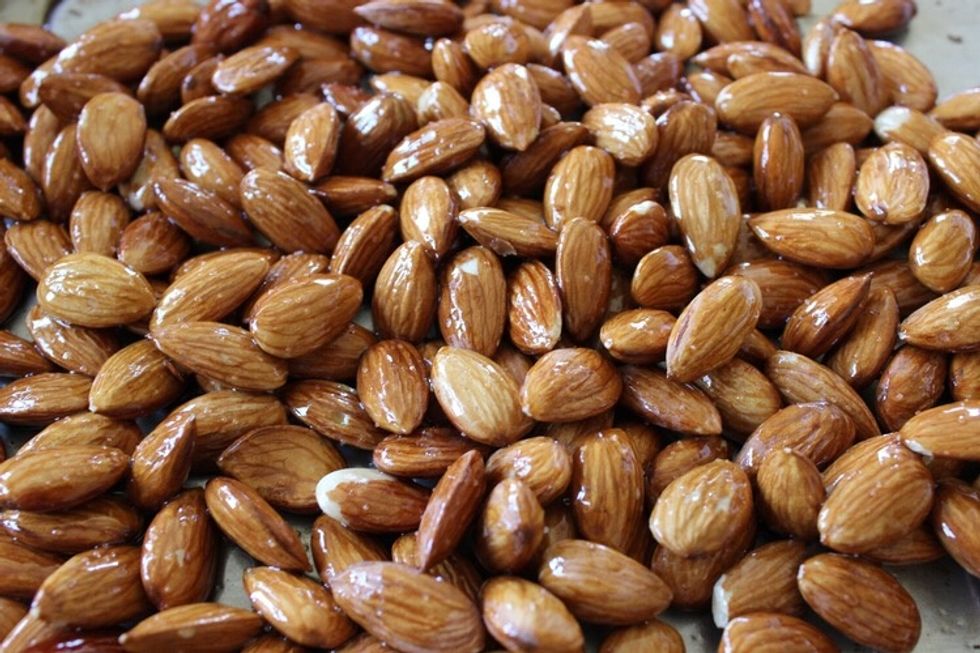 Toss the almonds in a little EVOO and salt. Bake at 350 degrees for about 8 - 10 minutes.