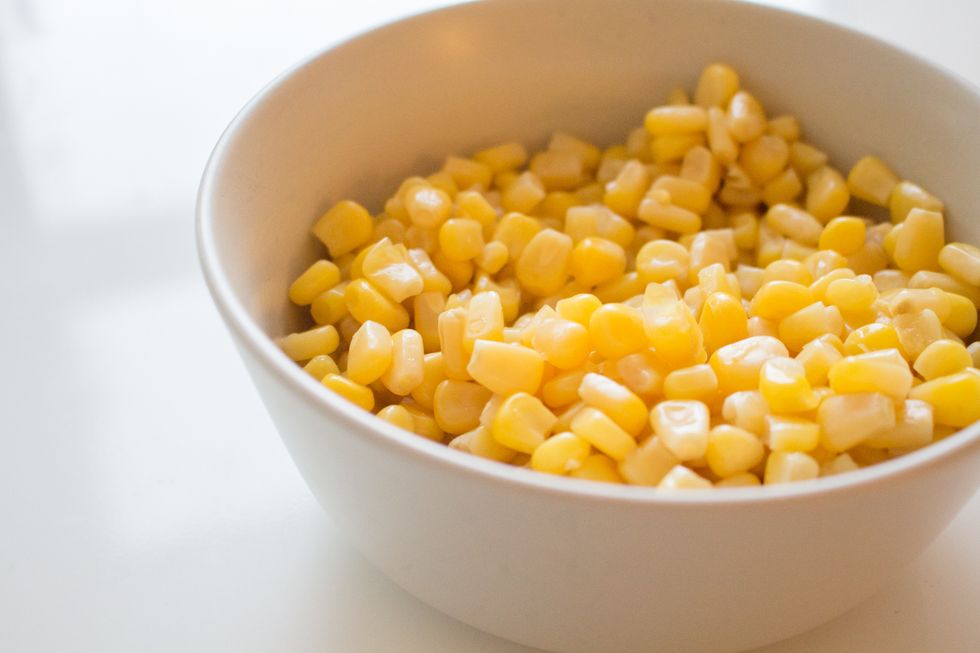 Toss the canned corn into the slow cooker