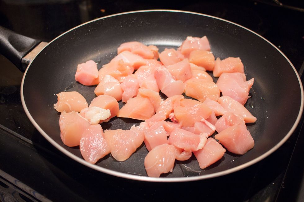 Toss the chicken on the heated skillet