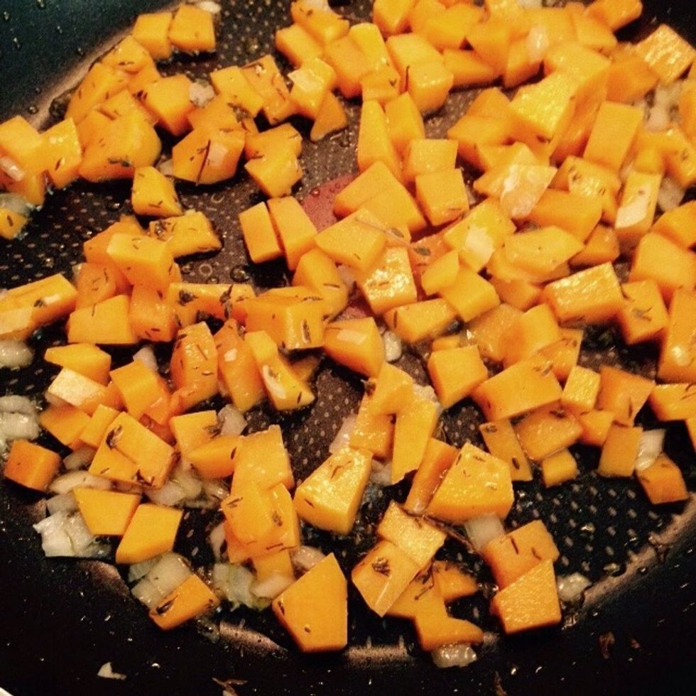 Toss the diced butternut squash in and add some thyme leaves