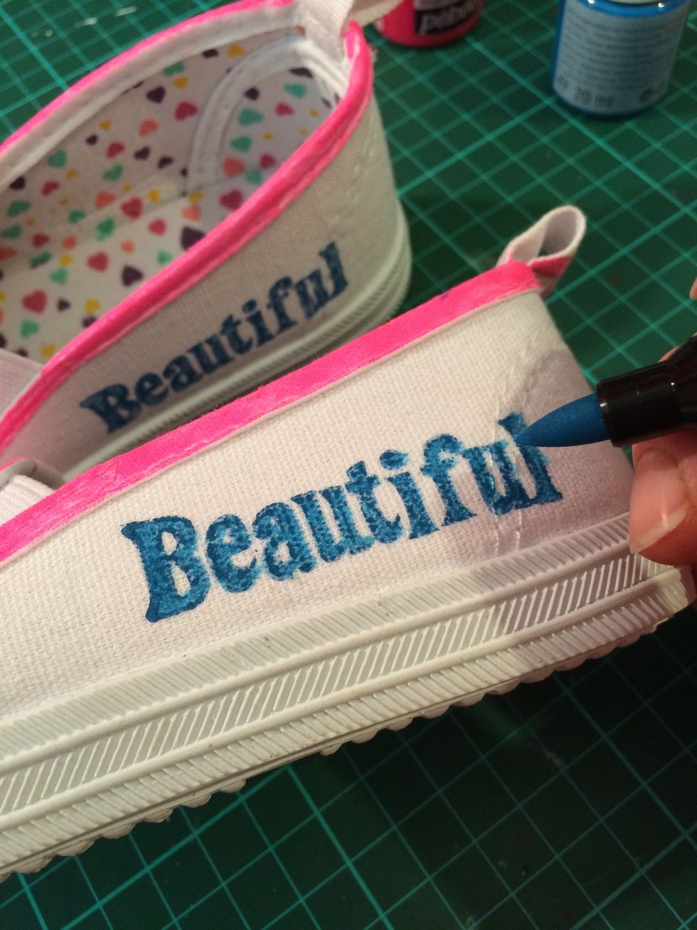 Touch up the stamps with your markers. I did this with the flowers too. It helps tie in the colours.