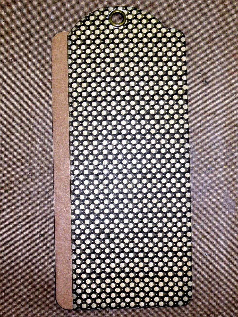 Trace a G45 Staples tag onto Inscribe but cut off the left shoulder as shown.  Glue the cut out tag to the Staples tag.  Use a 1/2" circle punch for the hole at the top.