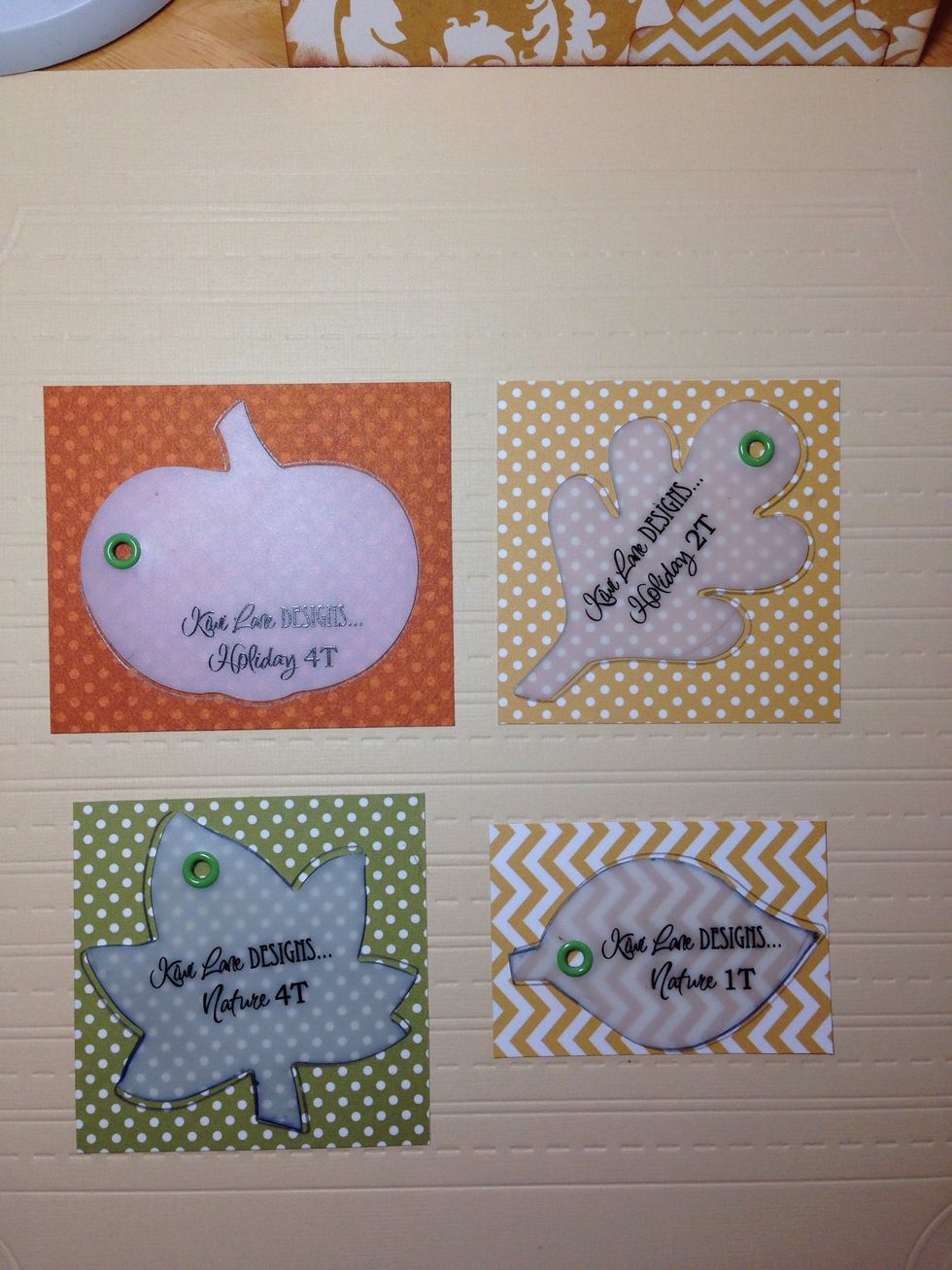 Trace a pumpkin and an oak leaf onto chosen paper using Kiwi Lane's Tiny Holiday 1T and 4T templates. Trace the maple and simple leaves with Kiwi Lane Design's Tiny Nature 1T and 4T templates.