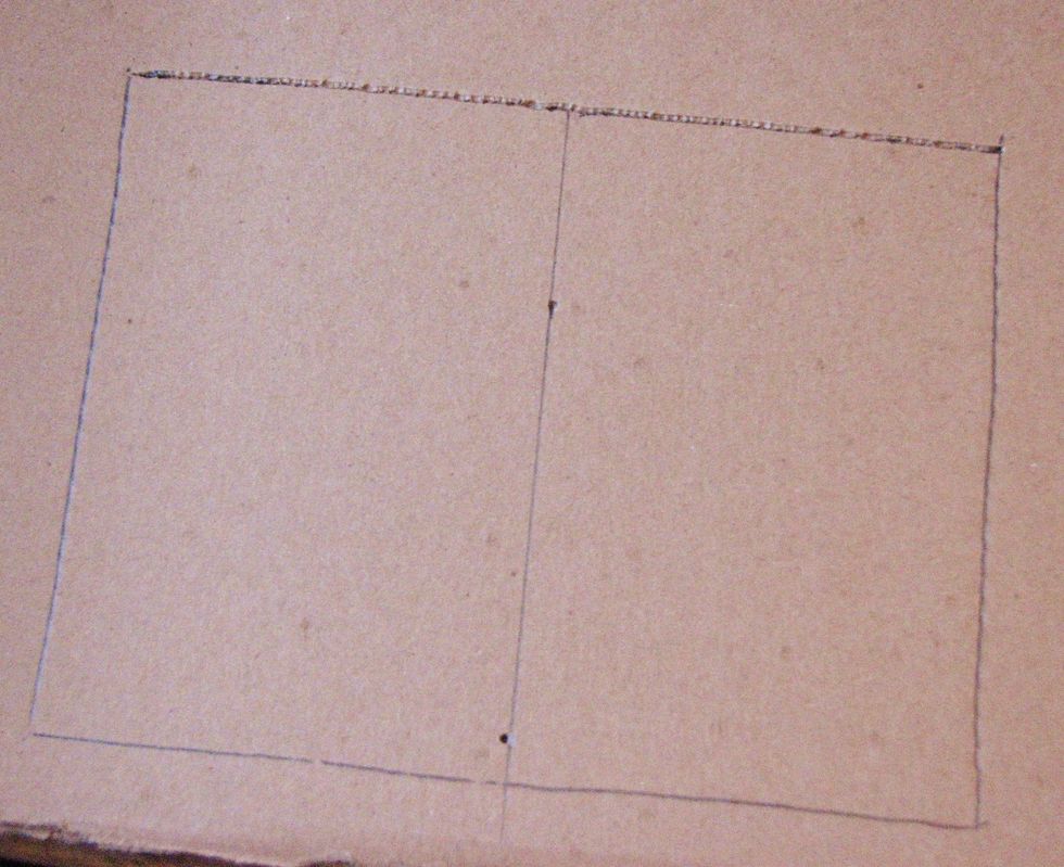 Trace a rectangle onto the second piece of chipboard that is the same size as the base of the house - in this case 8" x 6.5"