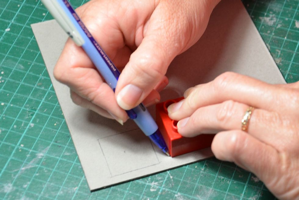 Trace around lego block. If you don't have a lego block the squares need to measure 3cm x 3cm and you will need 2 of these.