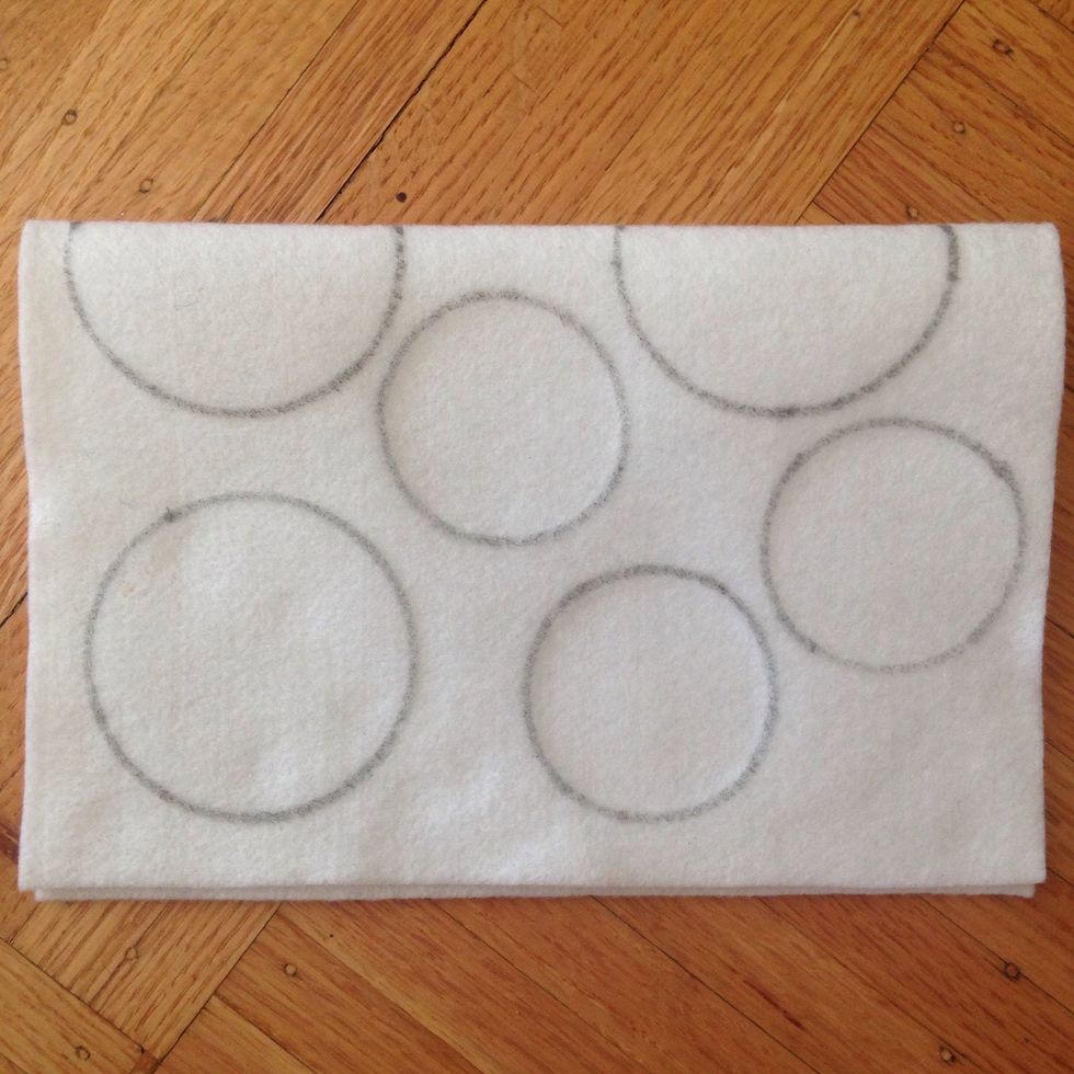 Trace out a selection of circles (or other shapes you wish to make) for decoration on the main felt canvas.