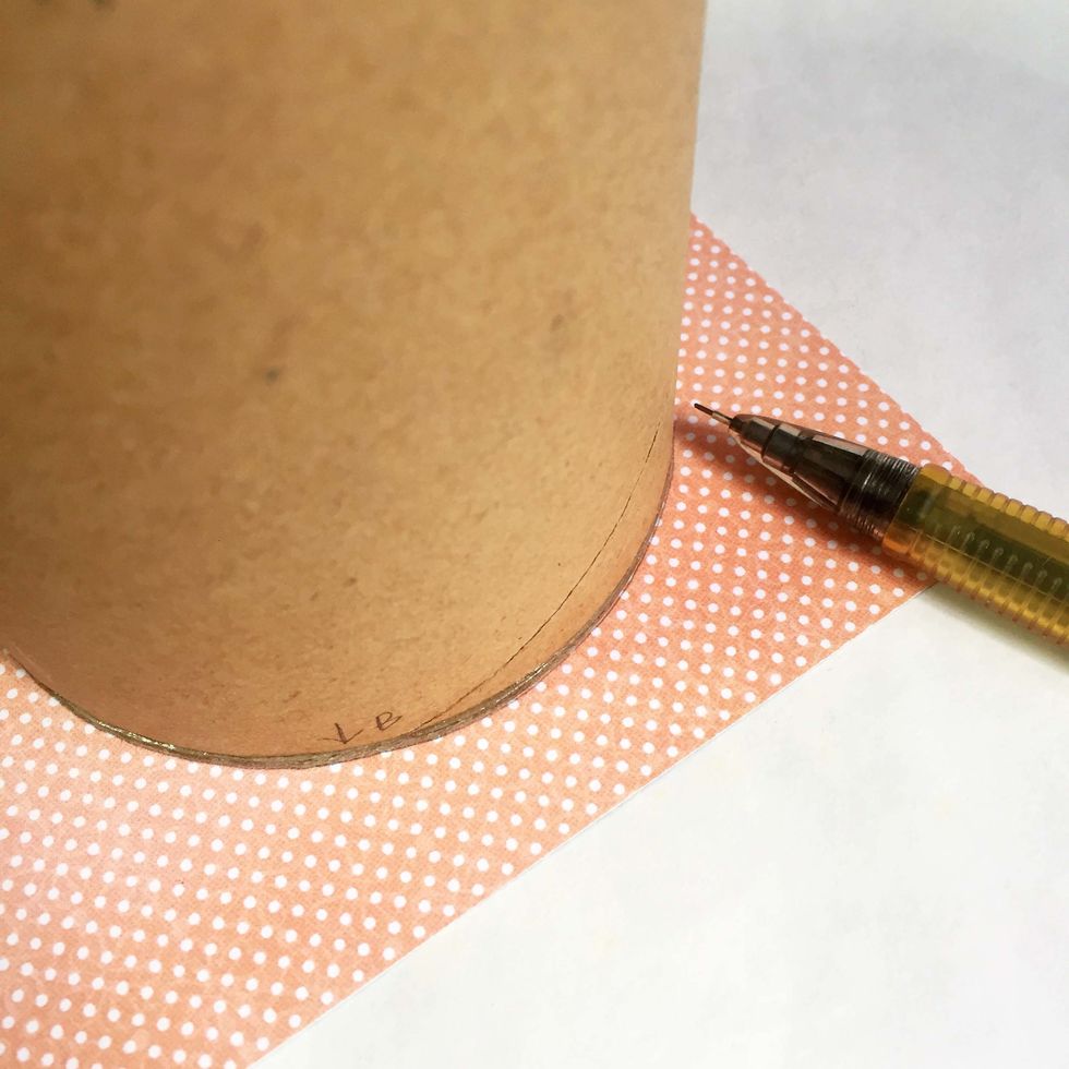 Trace out the bottom base onto a pattern paper of your choice using a mechanical pencil.