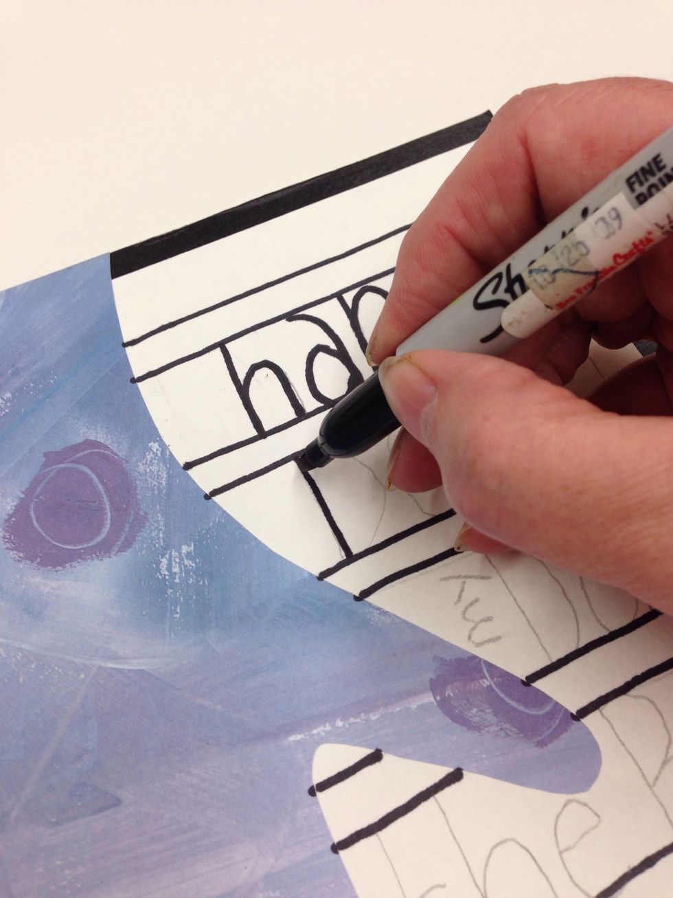 Trace over all of your pencil lines with the permanent marker. Erase any stray pencil markings that didn't get covered.