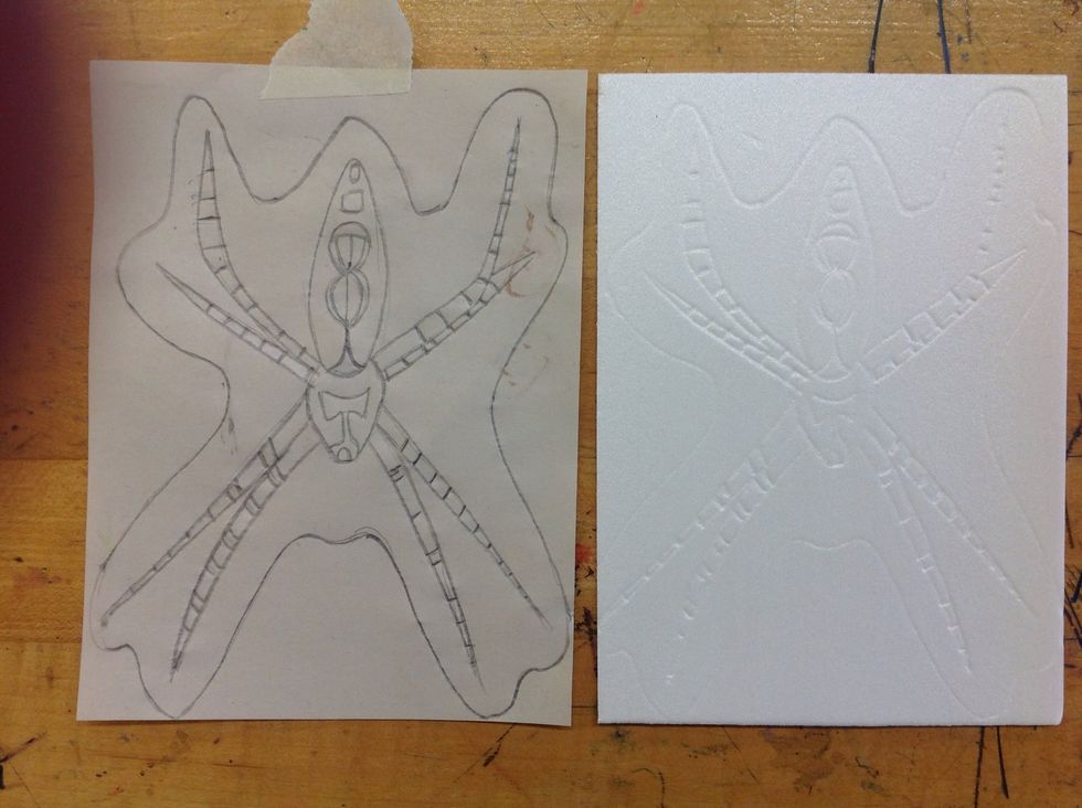 Trace over your lines with a dull pencil. When you are done you will see the image pressed into the styrofoam.