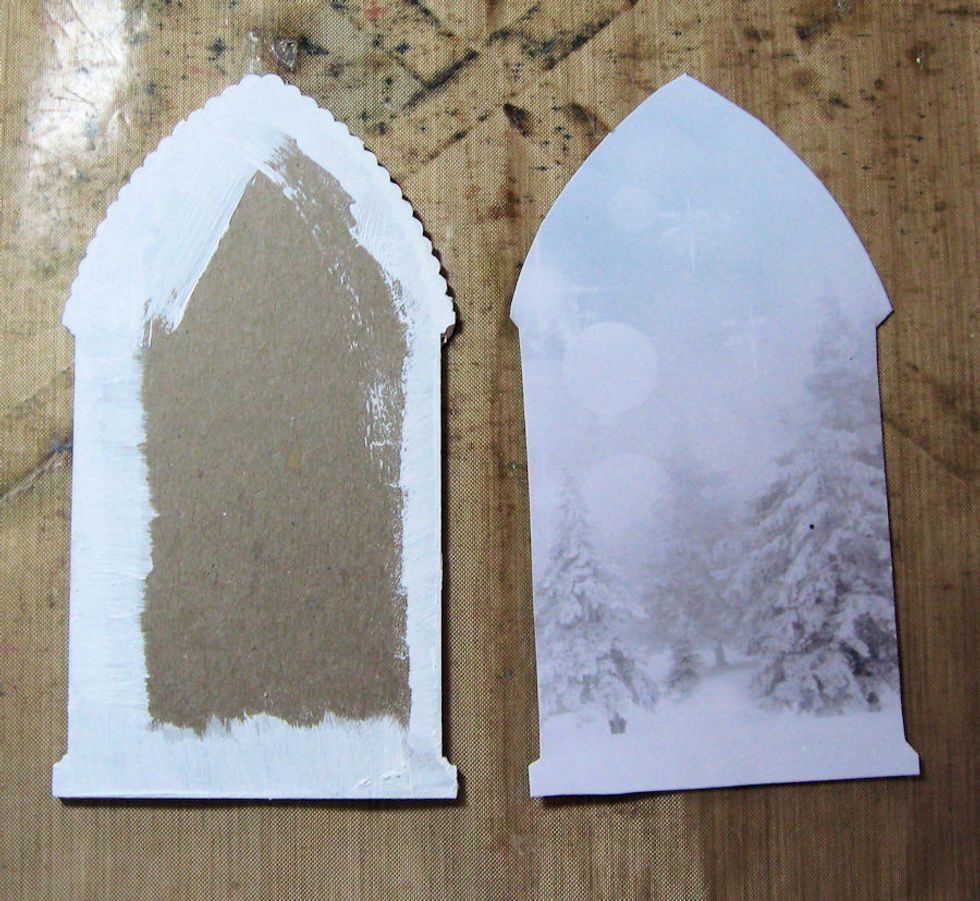 Trace the back of the arch frame onto Kaisercraft Frosted paper.  I used the trees photo paper.  Cut out with scissors.