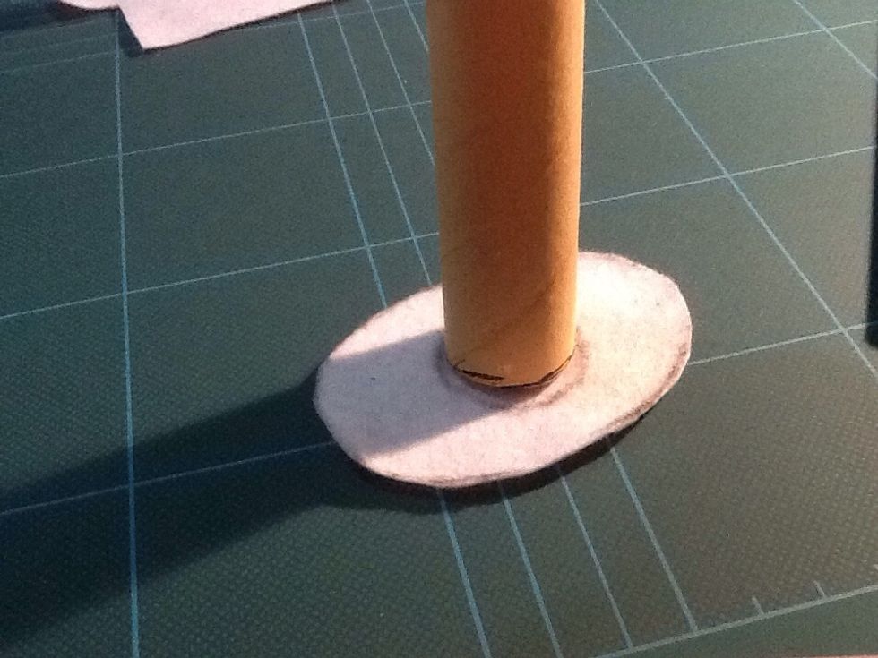 Trace the circle from the base of your cylinder tube onto the middle of your felt. Proceed to cut the little circle out.