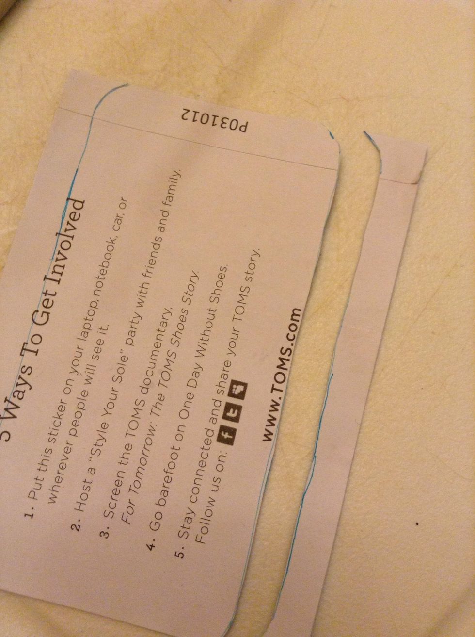 Trace the paper onto the backside of the sticker and cut it out