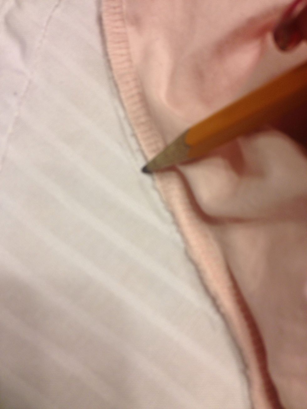 Trace the seam of the pink shirt. If you have a different color shirt you can use a pen or color pencil.
