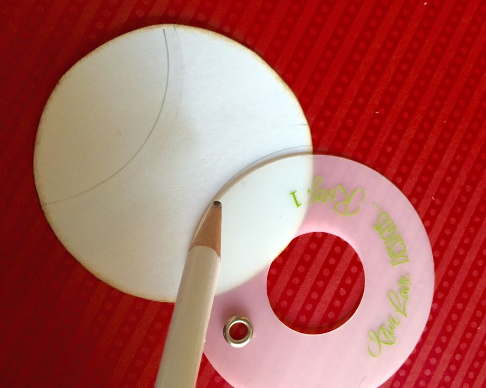 Trace the side of the circle on each end of your circle using a pencil. Leave a space in the middle.