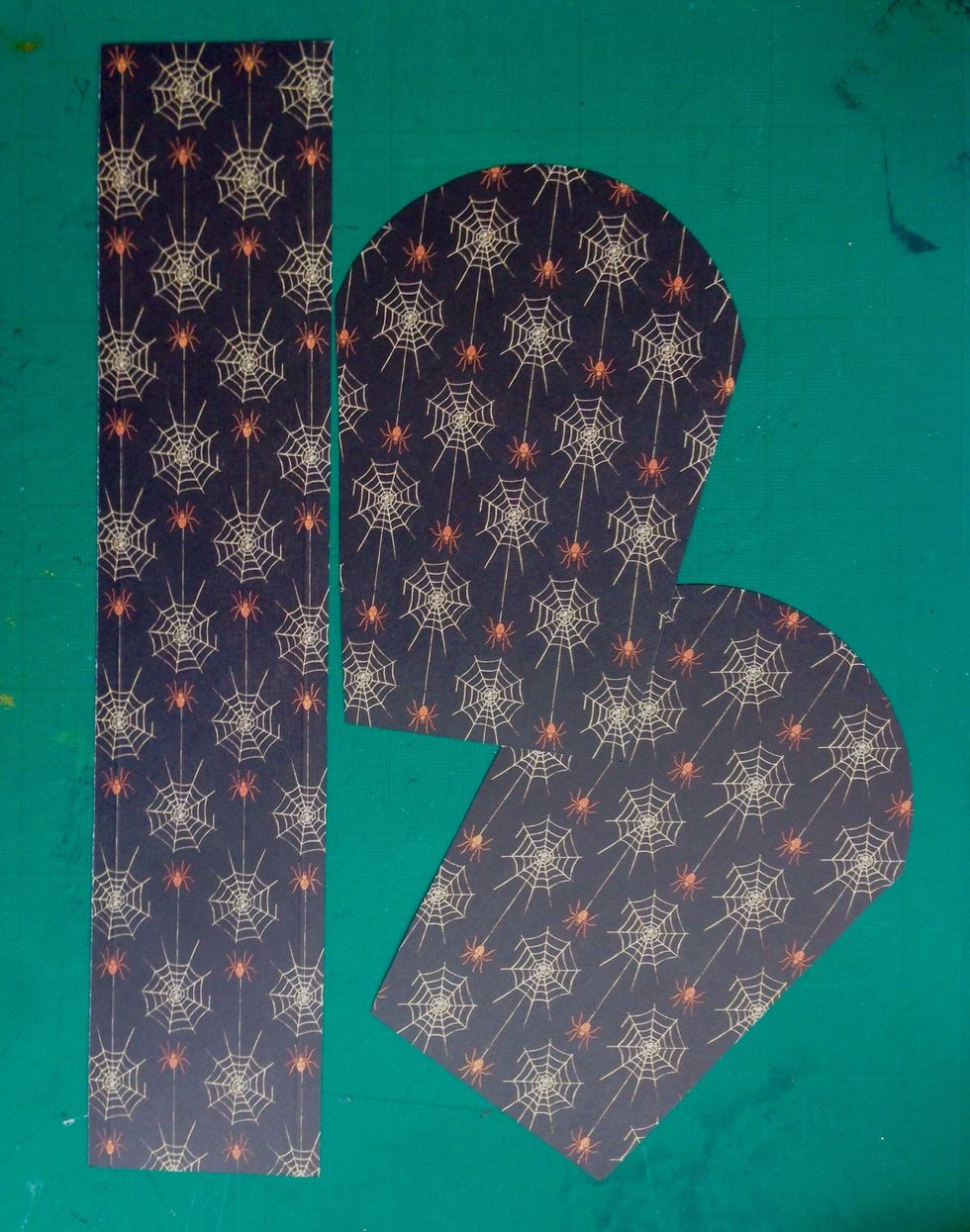 Trace the tomb template onto a pattern paper of choice; you will need 2 of them... And cut a 2.5" x 12" strip of paper as well...