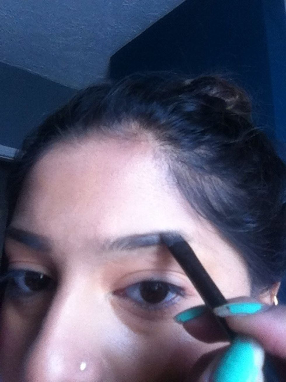 Trace two lines on at the top of your brows and one underneath then fill in the gap