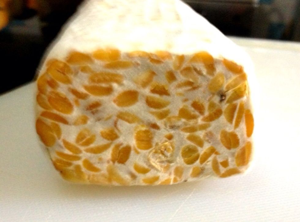 Traditional product of Indonesia. Made  by a natural and controlled fermentation process that binds soybeans into a cake form.