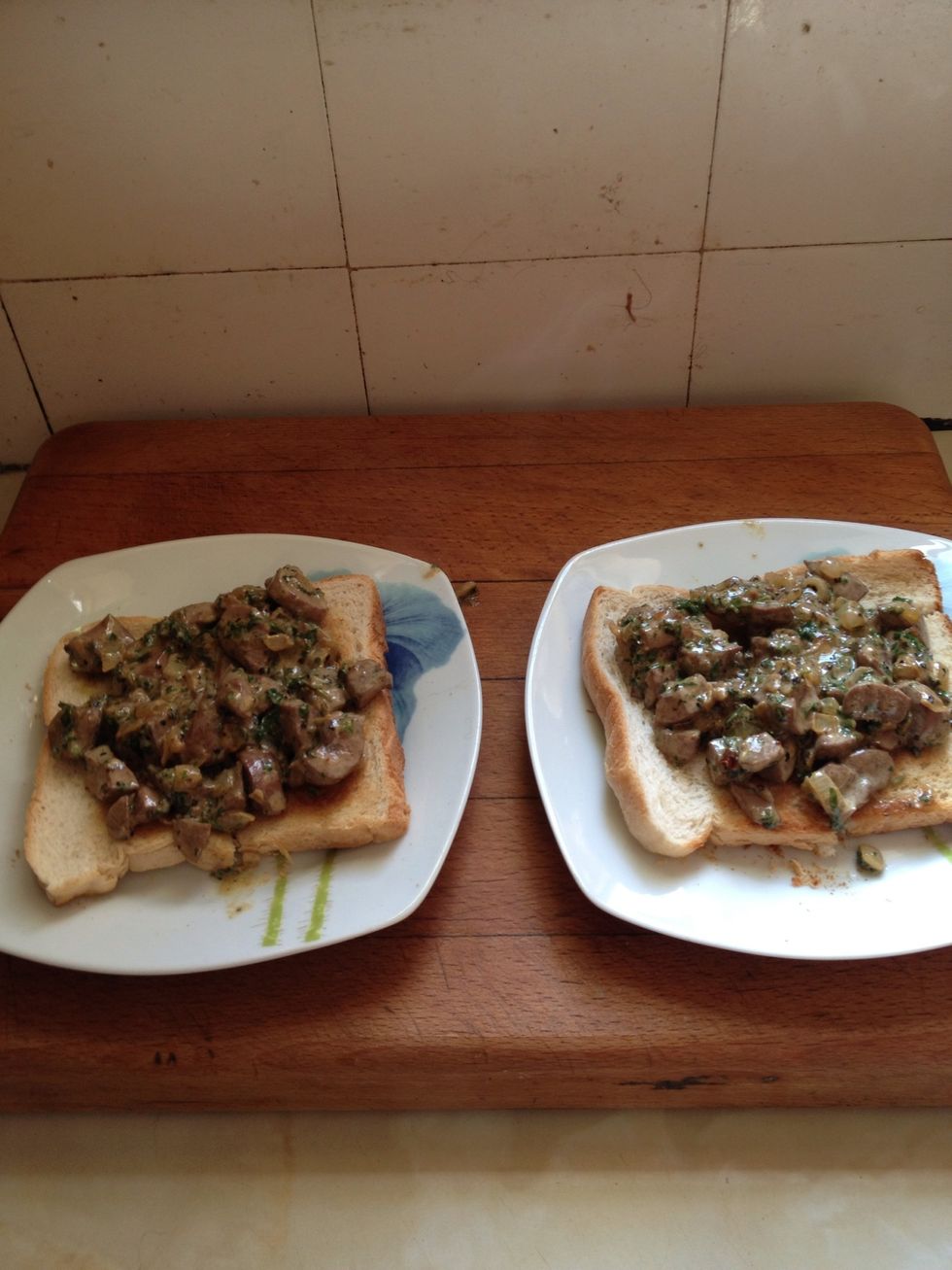 Traditionally served on fried bread  done in fat but in these days of less fat, just toast ,  enough for 2.