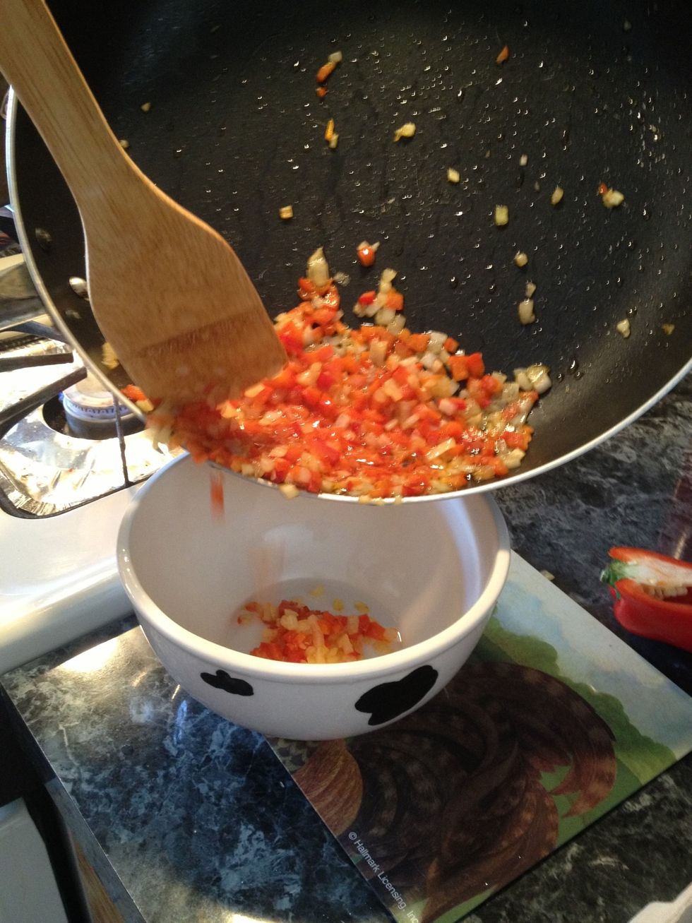 Transfer cooked onions and pepper to a bowl.