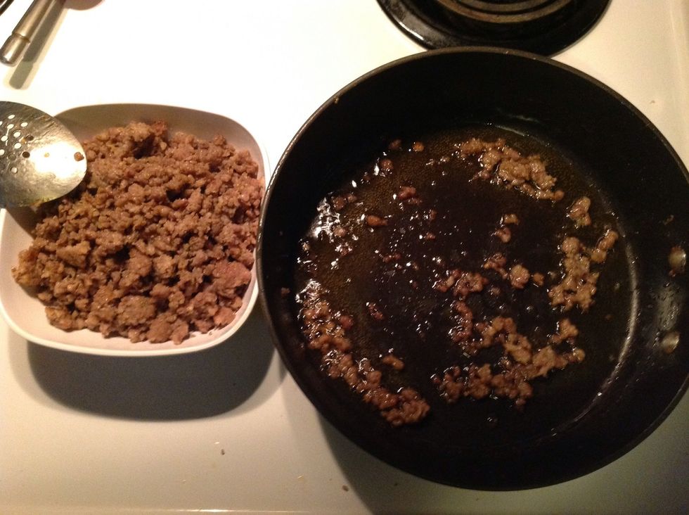 Transfer cooked sausage into a bowl leaving sausage drippings(grease) in skillet.