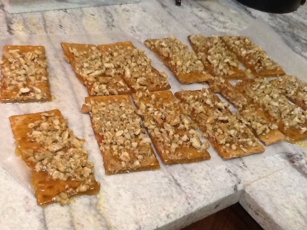 Transfer crackers immediately from pan to wax paper to cool.