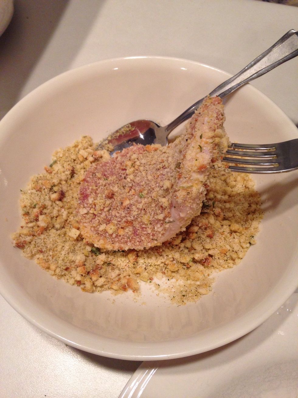 Transfer egg-coated pork to bread crumb mixture and coat well.