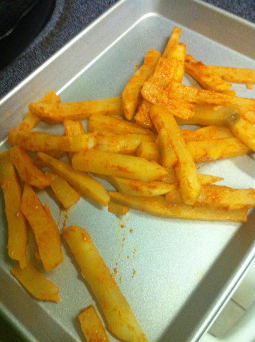 Transfer fries to your greased baking sheet....