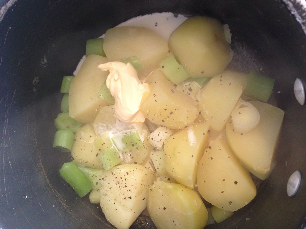 Transfer into a large bowl and add pepper, a dash of milk and a knob of butter then mash