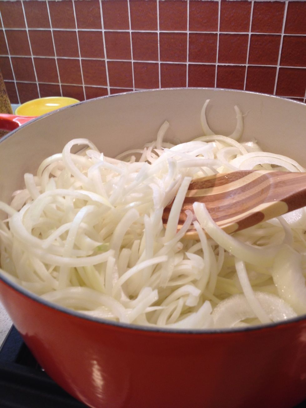 Transfer of the onion into the Dutch oven. Cook for 10 minutes and stir and every 3 to 4 minutes. Don't worry it may seem like a lot of onion , but it will shrink.