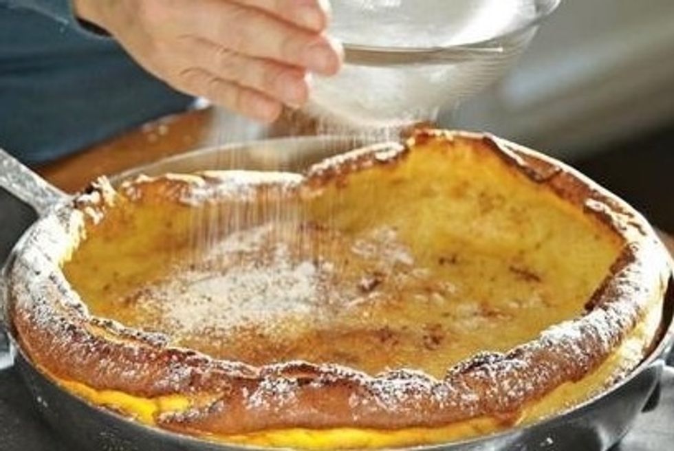 Transfer skillet to a wire rack and sprinkle with lemon juice and confectioners' sugar.