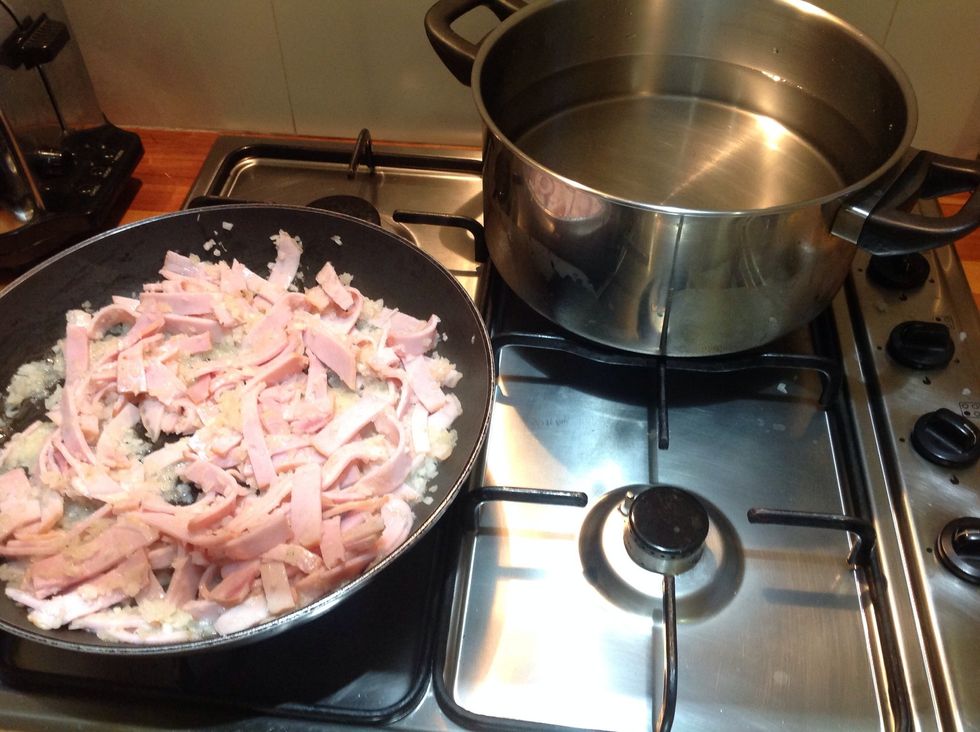 Transfer the bacon mix to a pan and start to boil the water