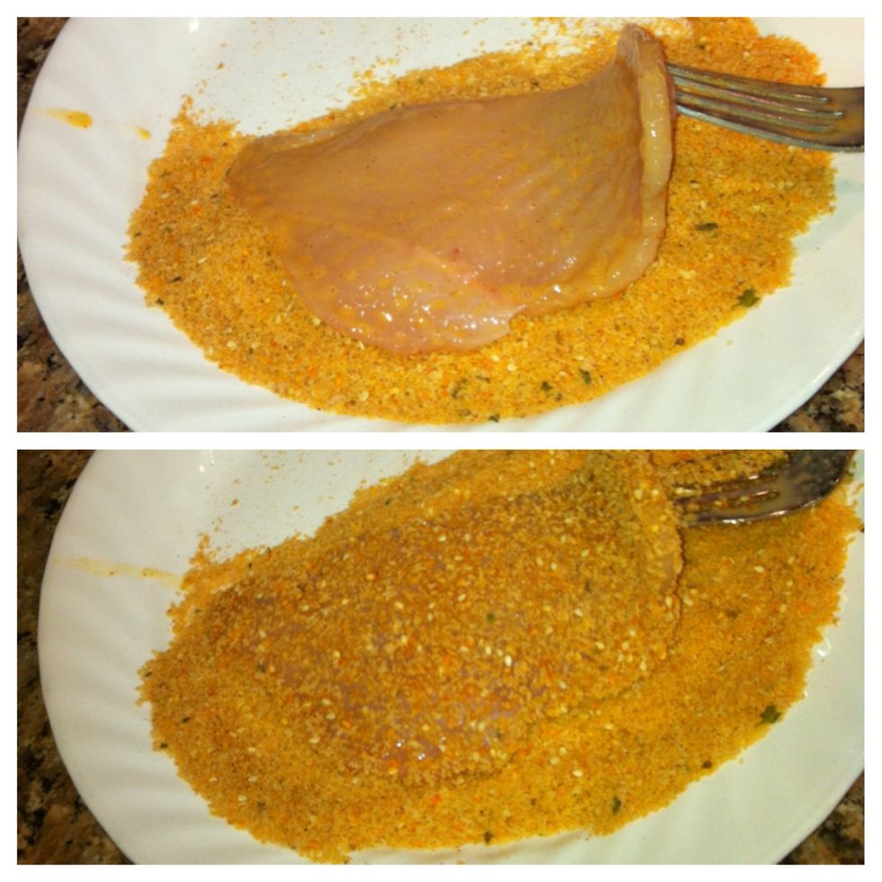 Transfer the chicken from the egg mixture to the dry mixture and coat it on both sides. Set aside and repeat with the rest of the chicken.