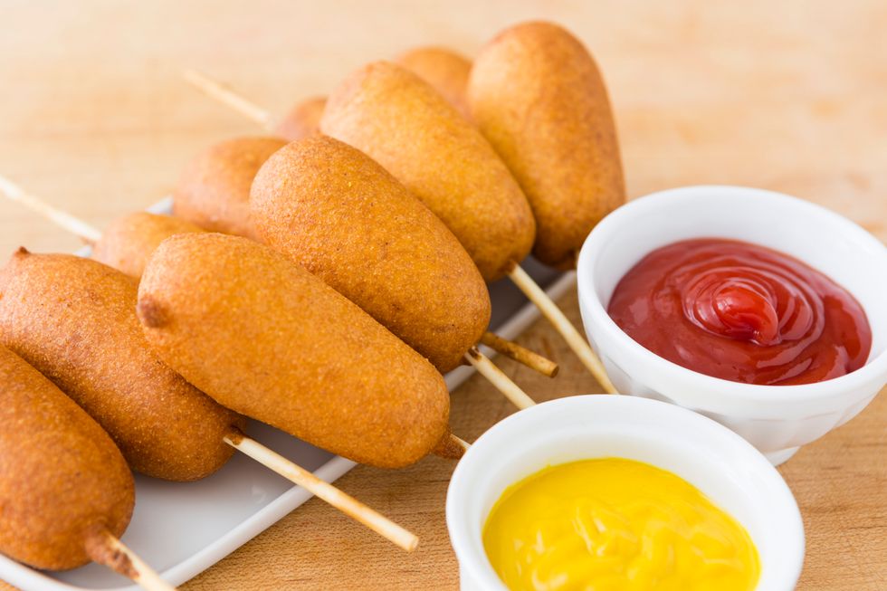 Transfer the finished corn dogs to a paper towel-lined plate.