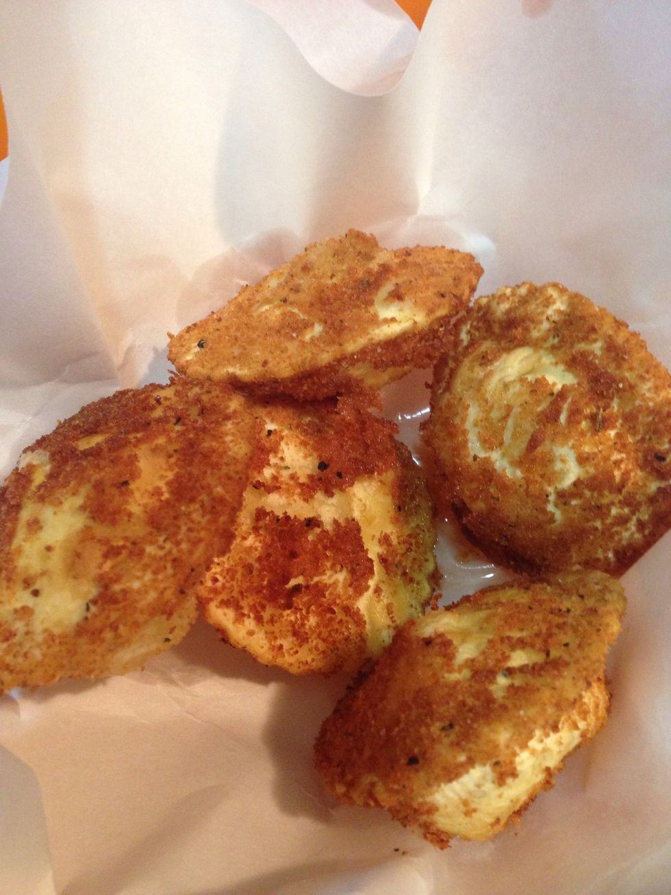 Transfer the fry rafioli to paper towel to absorb all the oil.