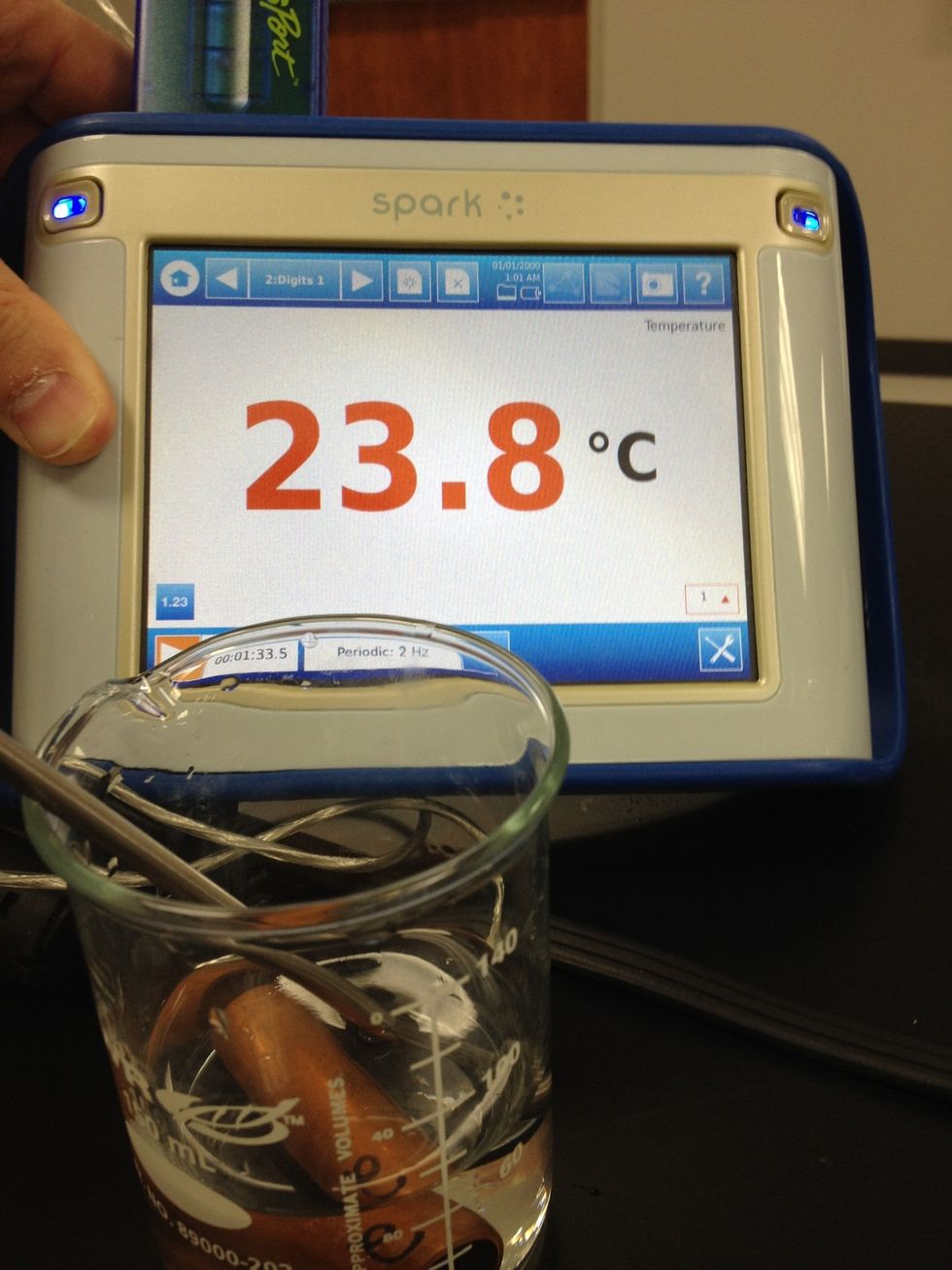 Transfer the metal QUICKLY to the cool water and watch the temperature - stirring a little until it stabilizes. Record the stable temperature.