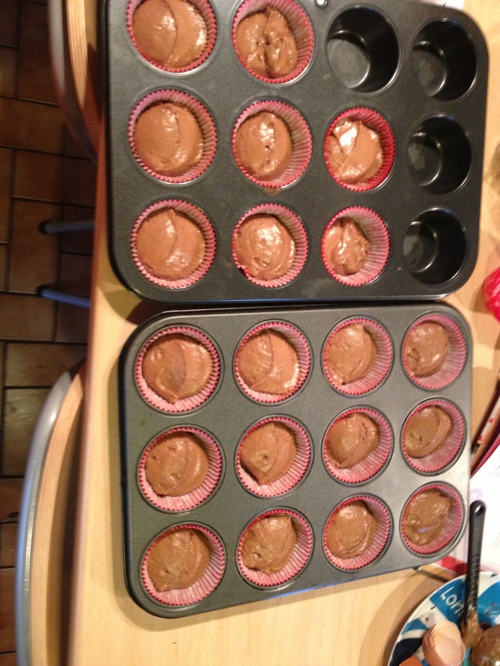 Transfer the mix to the cases. You can use spoons or scoops. My mix made 19.5 cupcake.