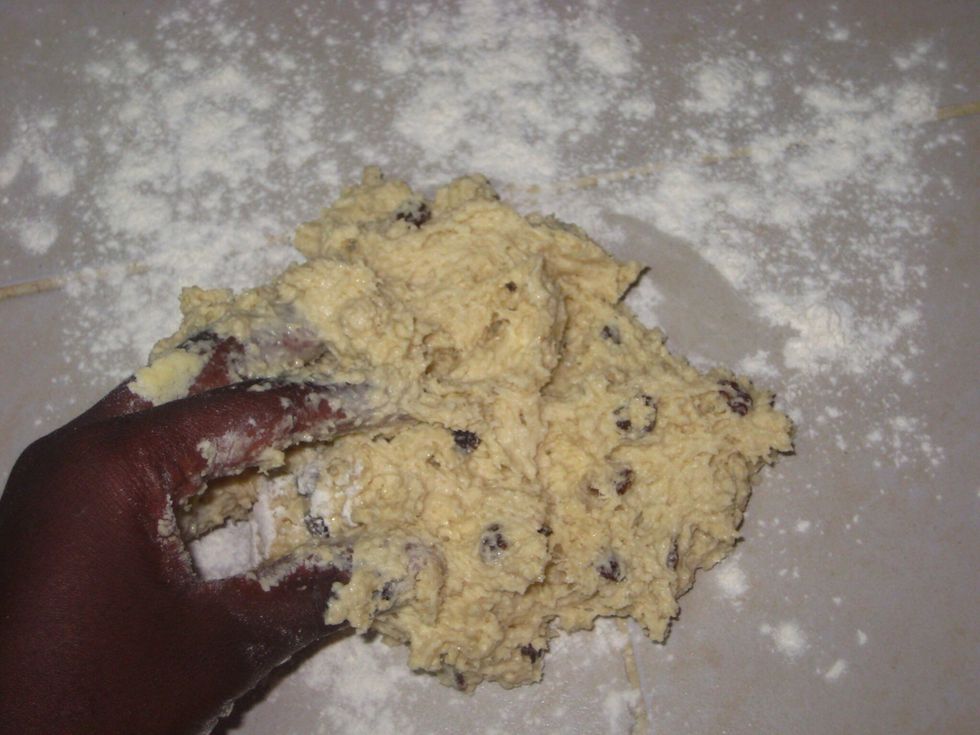 Transfer the sticky dough to the floured surface