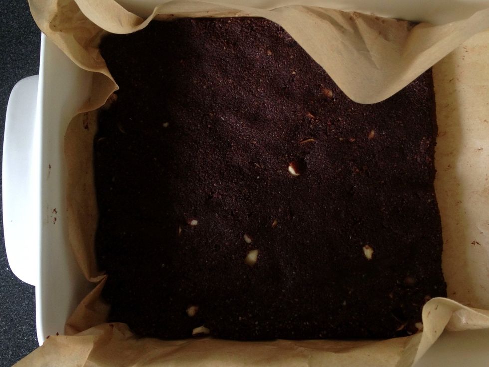 Transfer the tossed mixture to a fully lined square brownie or cake tin and press it in to your desired thickness. Refrigerate and wait until hard. The brownies, not you. About 1-2 hours.