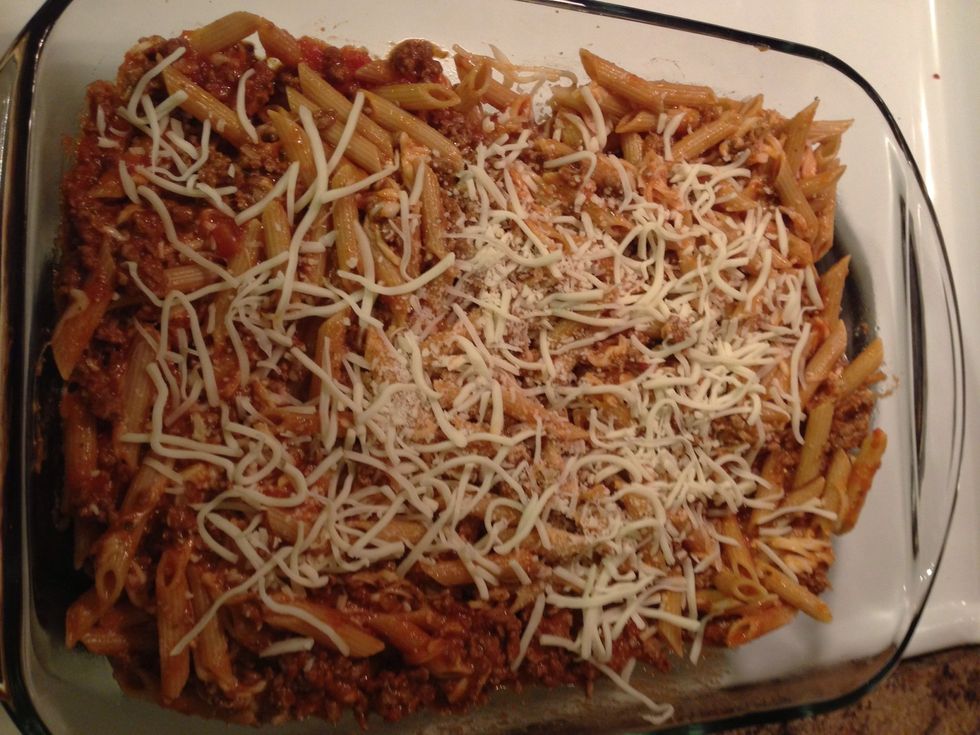 Transfer to 13 x 9 baking pan. I lightly greased the pan before as well. Add remaining cheese to top.