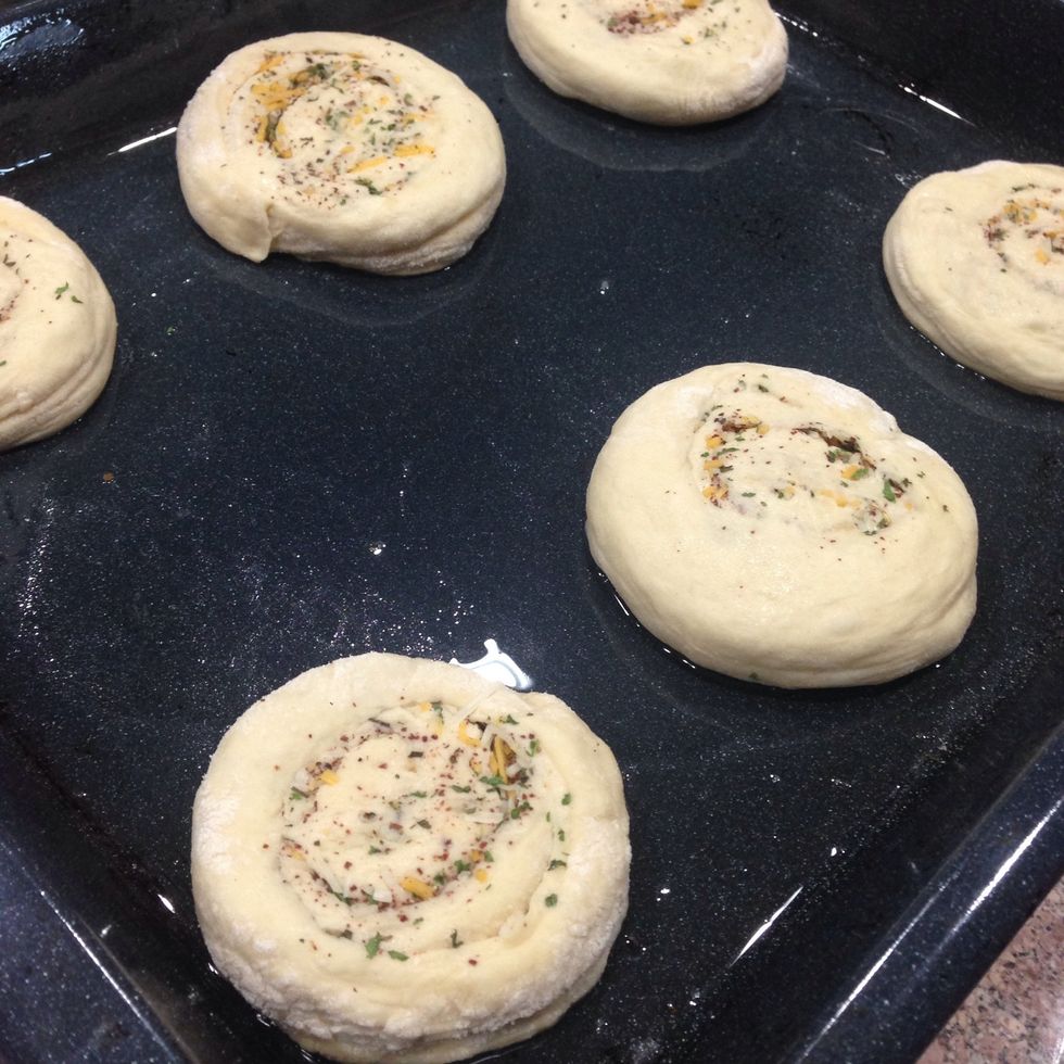 Transfer to a baking sheet. Press on them with hand.