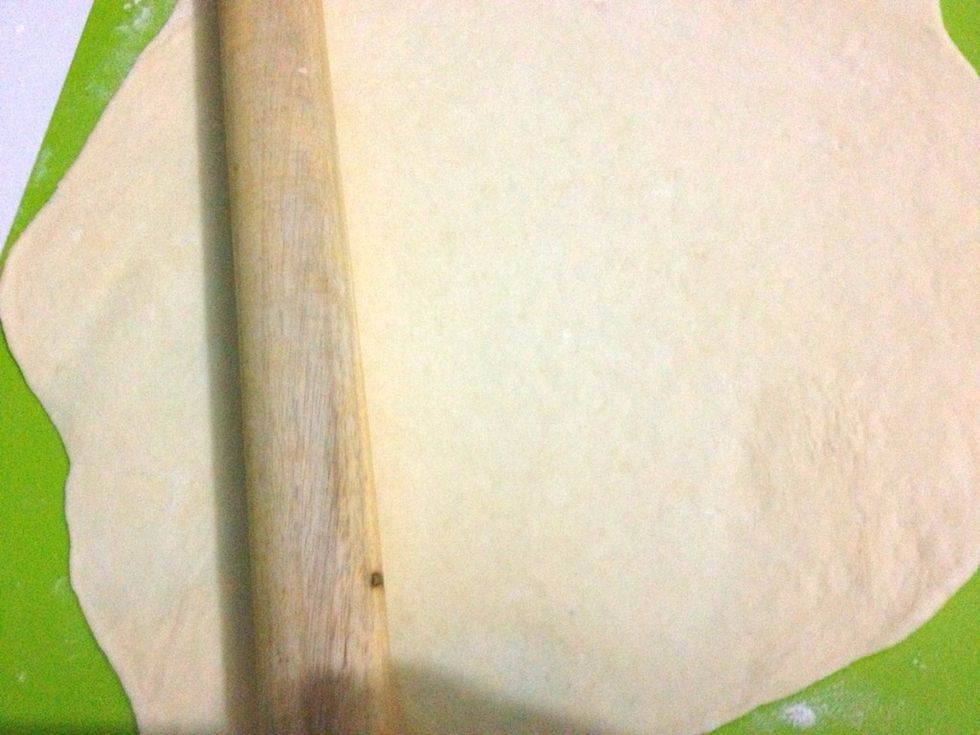 Transfer to a floured surface and use your rolling pin and start to roll into rough rectagle about 1cm or 1/2 inch thickness. Add more flour for dusting