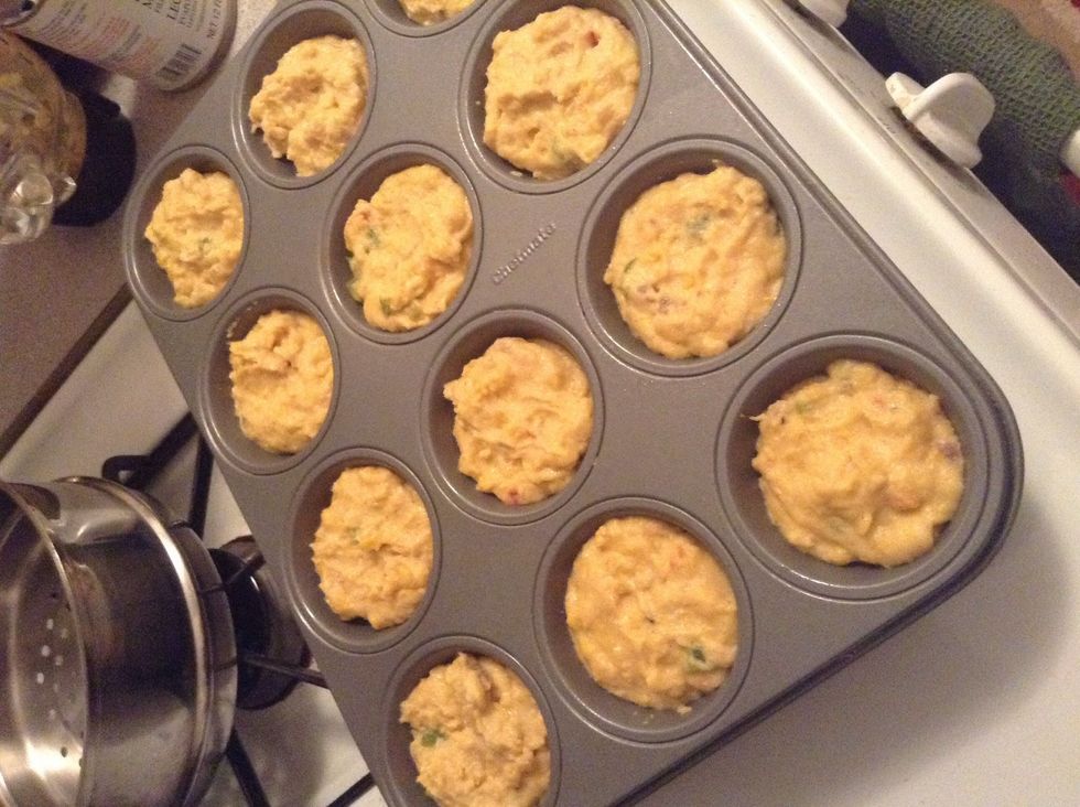 Transfer to cupcake/ muffin tins (sprayed beforehand with cooking spray )...