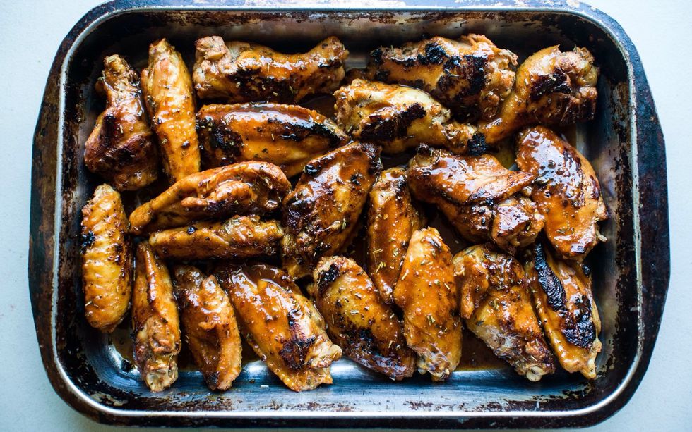 Transfer wings to a pan (sprayed with Pam) to put in the oven. Cookie sheets are great for this as well. I use a pan to hold all the juices for my wings when they are done! Place wings in for 30 min.