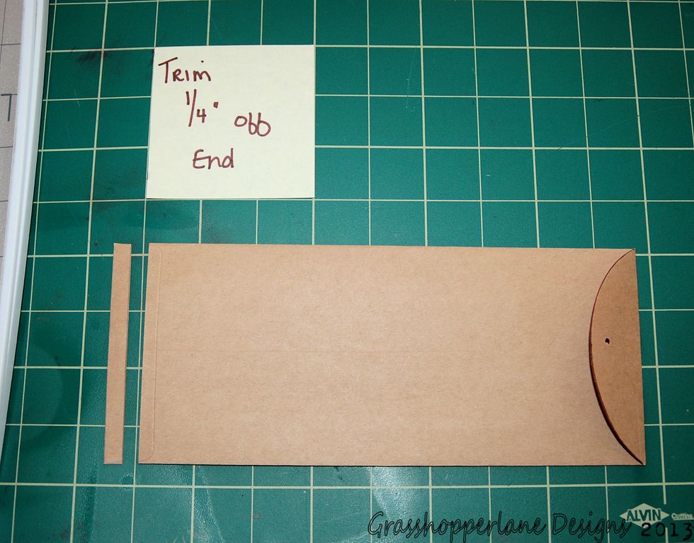 Trim 1/4" off the end of your policy envelope.