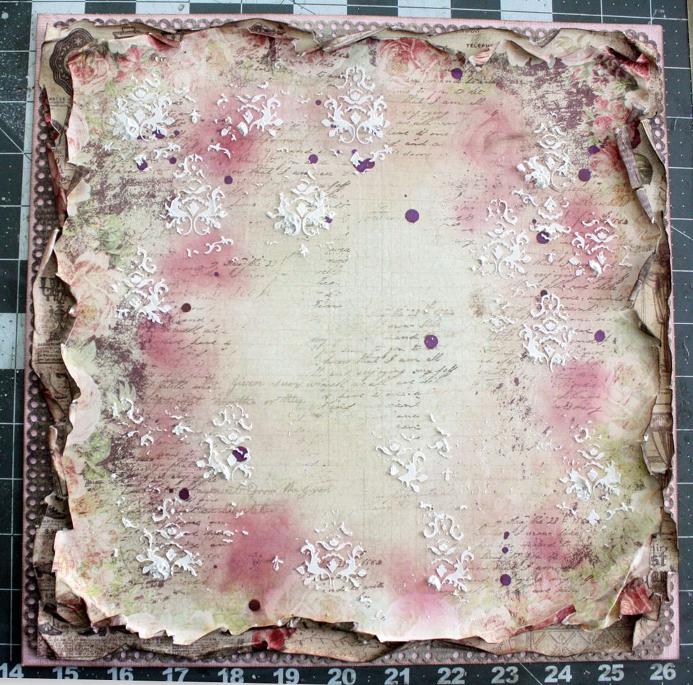 Trim 1/4" or more on each side of the focal paper and heavily distress. Then add to the top of all your layered papers.