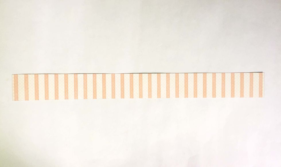 Trim a strip of 1.25" wide from the pattern paper of your choice.