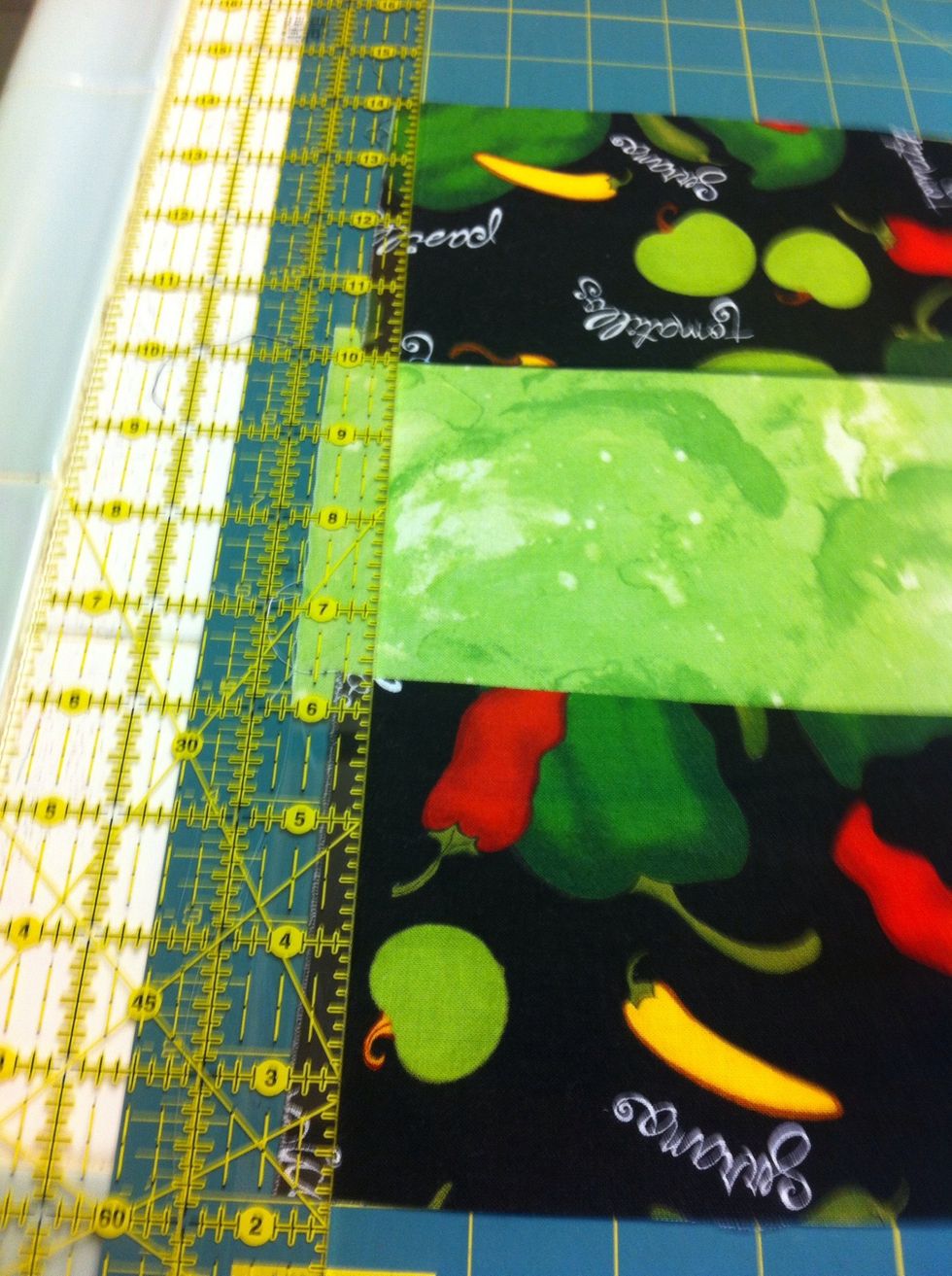 TRIM. Align on rotary cutting mat. Trim to straighten edges.