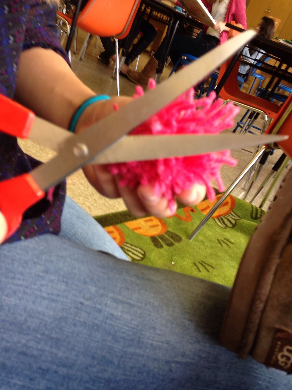 Trim all the uneven pieces of yarn that are sticking up