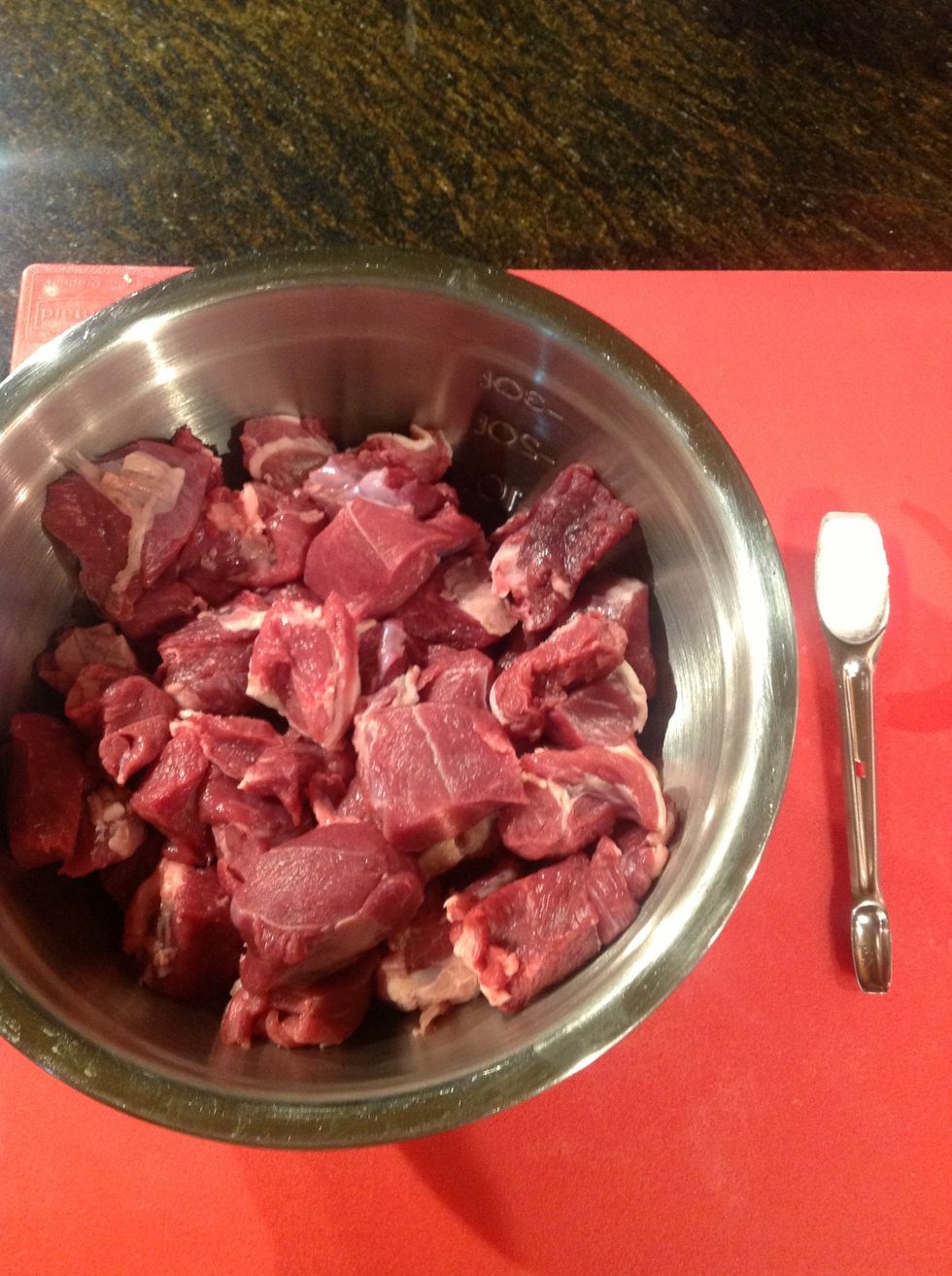 Trim and cut lamb into cubes toss with kosher salt.